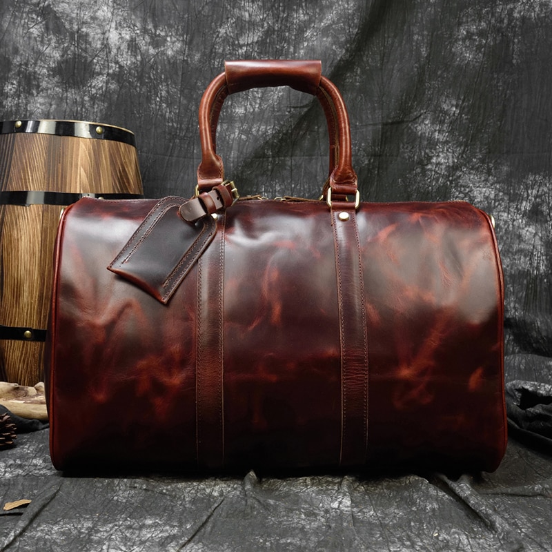 Genuine red leather business travel luggage for men.