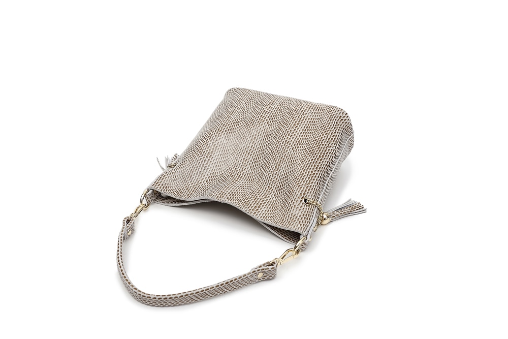 Leather shoulder bag with embossed snake pattern for girl.