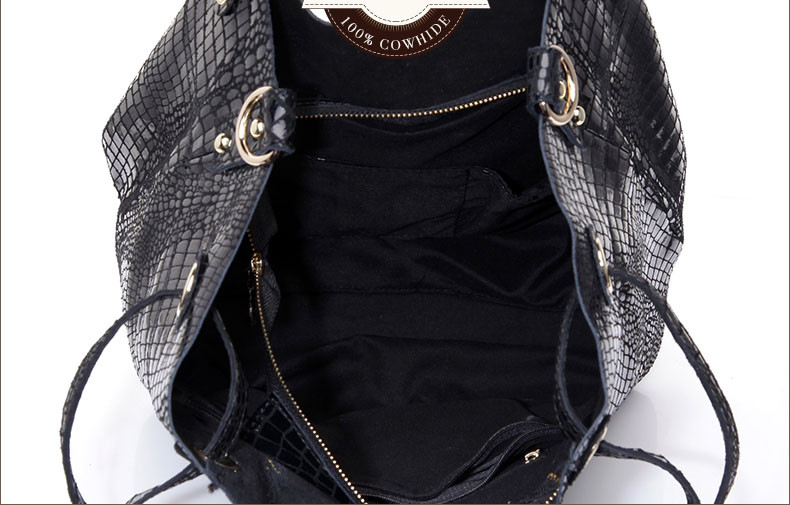 Genuine leather women's handbag with shiny crocodile.