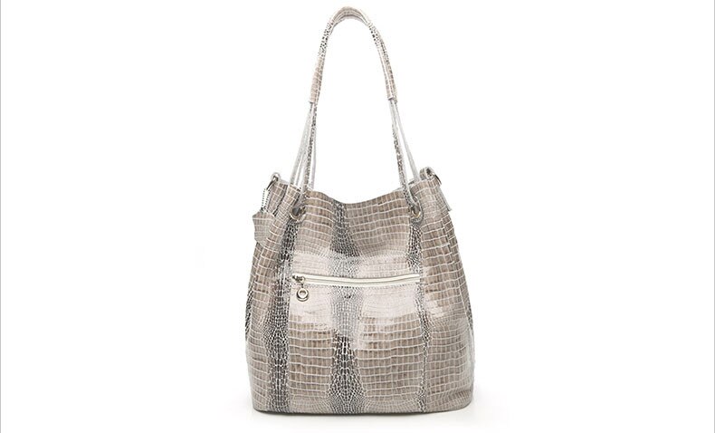 Genuine leather lady's shoulder bag with shiny crocodile pattern.