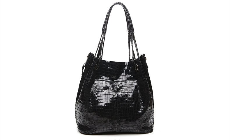 Natural leather lady's shoulder bag with shiny crocodile pattern.